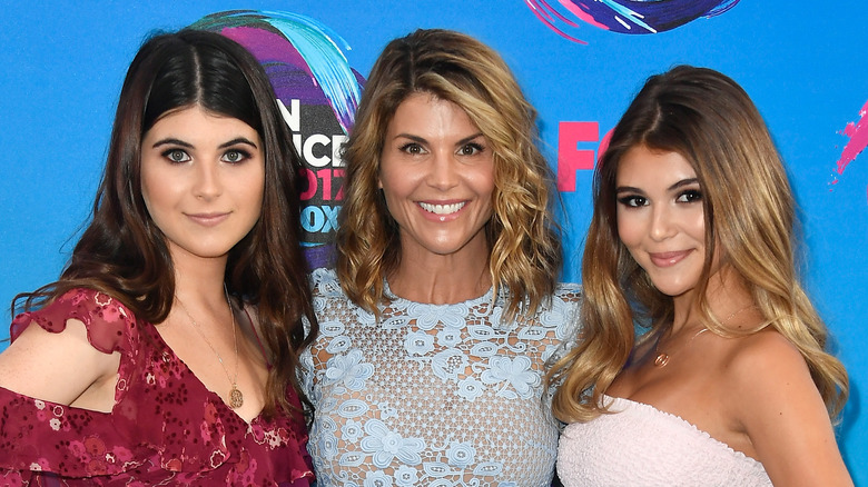 Lori Loughlin smiling with her daughters