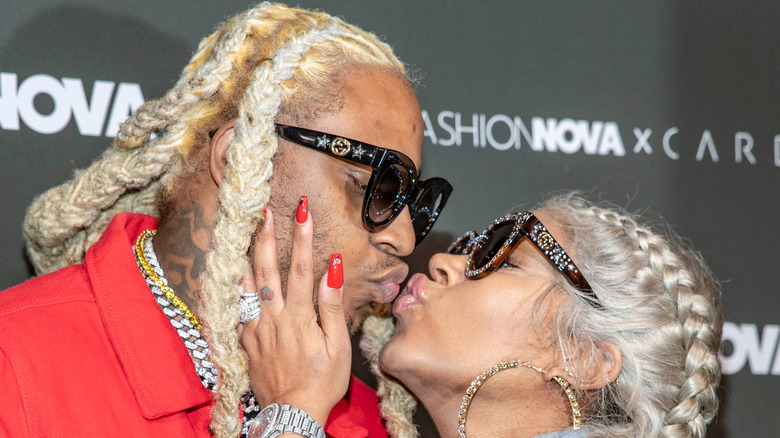 A1 Bentley and Lyrica Anderson kissing