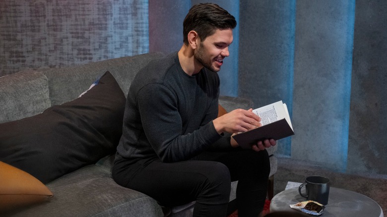 Kyle holding notebook