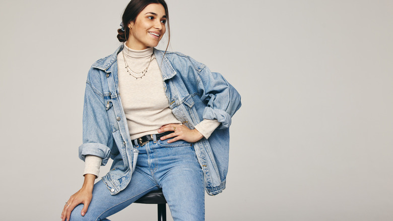 Woman in denim jacket and jeans