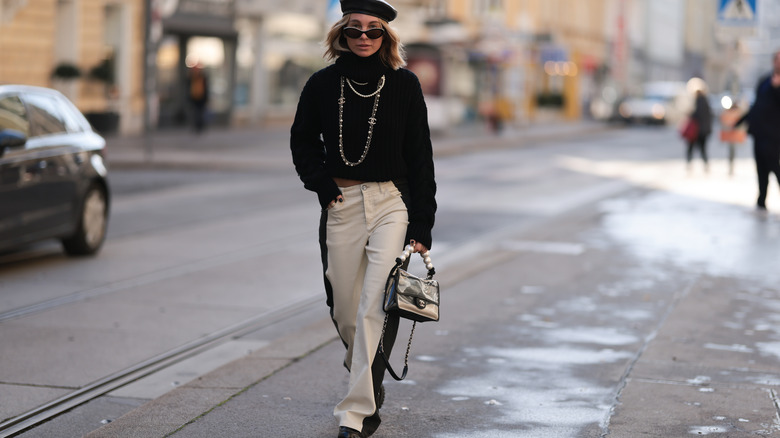 Fashionable woman walking on street