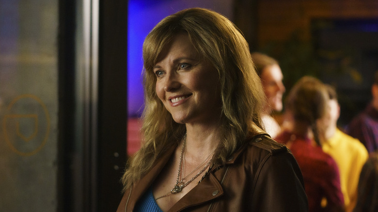 Lucy Lawless smiling in My Life Is Murder
