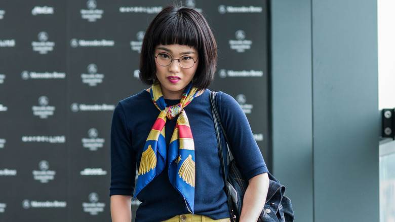 Woman wearing Hermes scarf