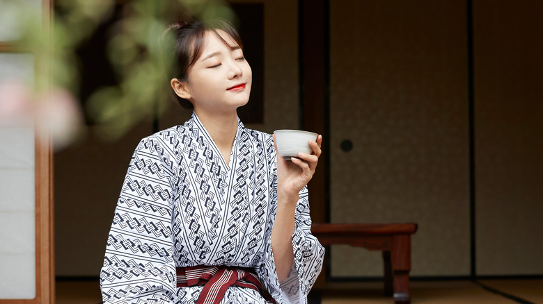 Japanese woman outside tatami room