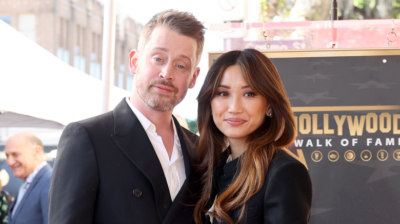 Macaulay Culkin and Brenda Song pose at Hollywood Walk of Fame