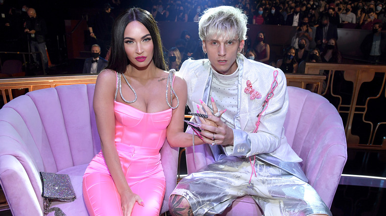 Machine Gun Kelly and Megan Fox at an event.