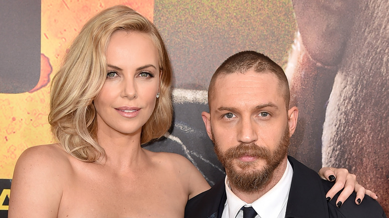 Charlize Theron and Tom Hardy pose on the red carpet together