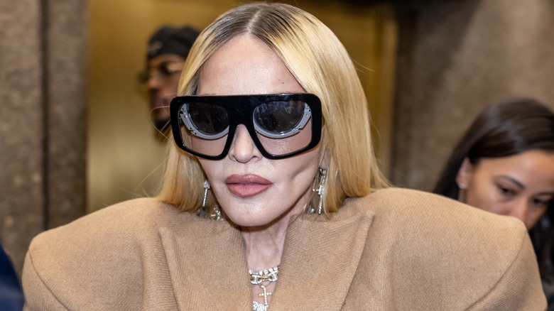 Madonna in sunglasses, with sunken cheekbones