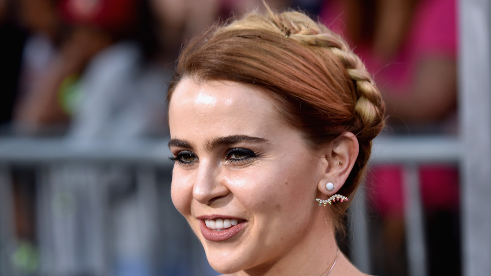 Mae Whitman smiles at an event