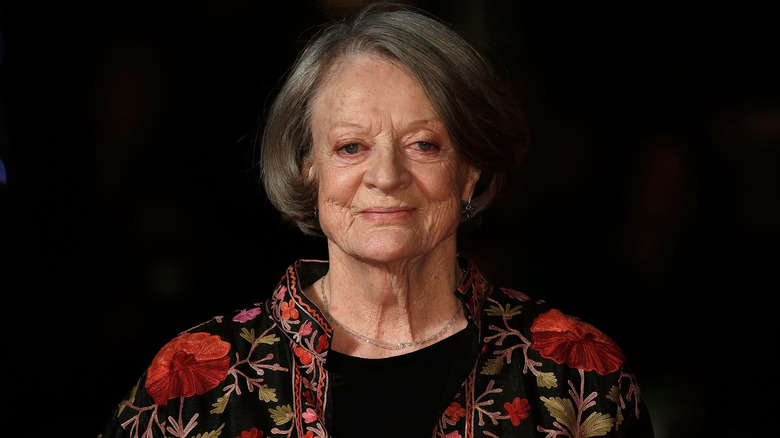 Maggie Smith smiling with floral jacket