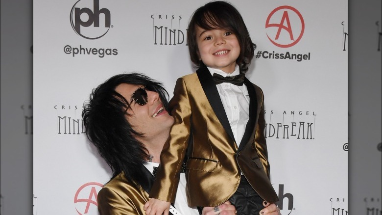 Criss Angel posing with his son Johnny Crisstopher