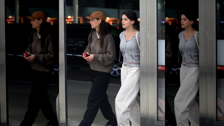 Suri Cruise walking with Katie Holmes