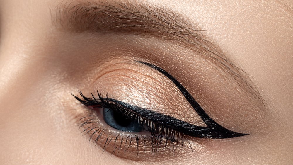 Close-up of a woman's eye with winged eyeliner