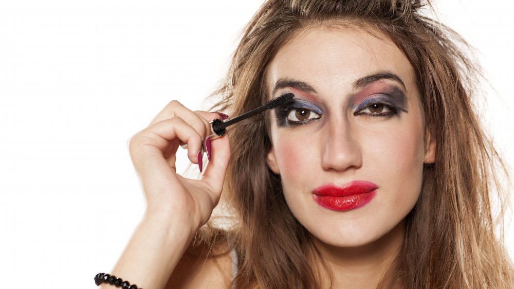 A woman wearing very messy makeup