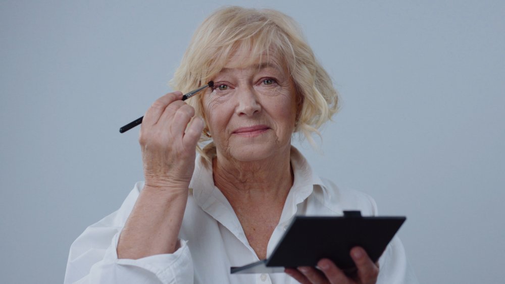 Woman applying eyeshadow