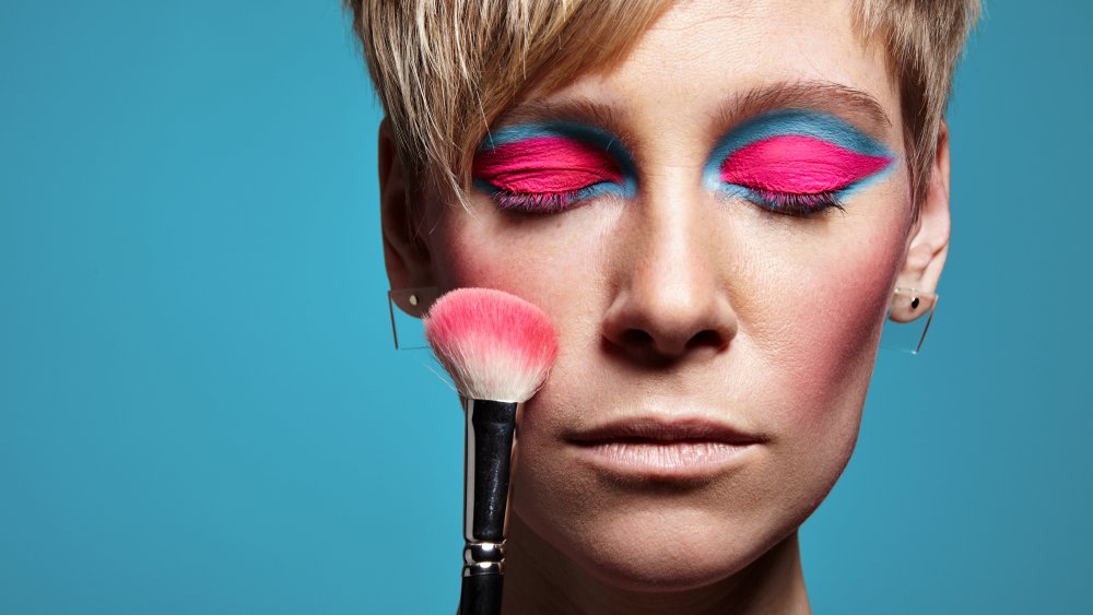 A woman wearing the technicolor makeup trend