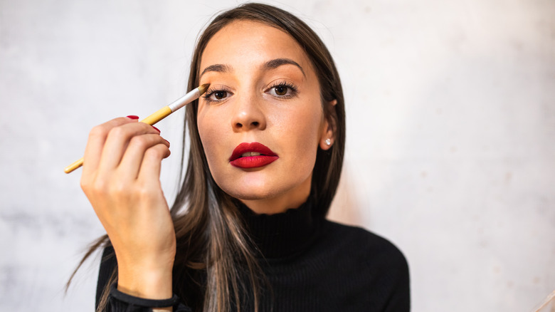 Woman applying natural eyeshadow