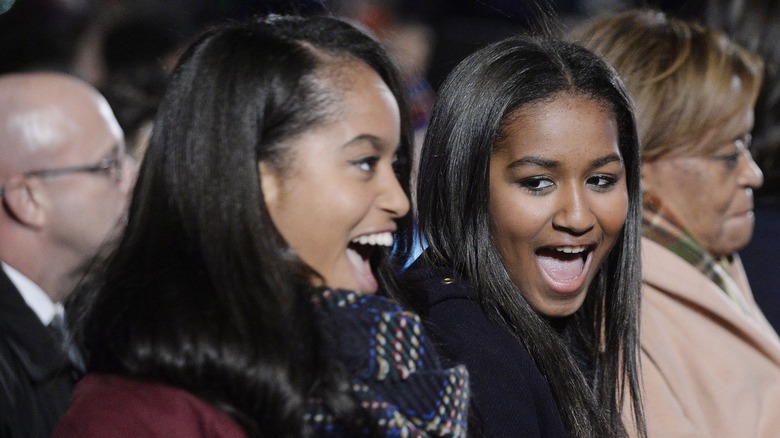 Malia and Sasha Obama laughing