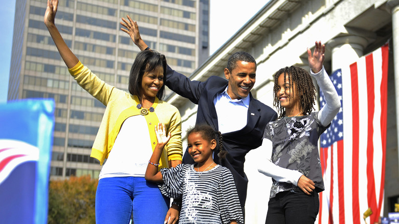 The Obama family waving