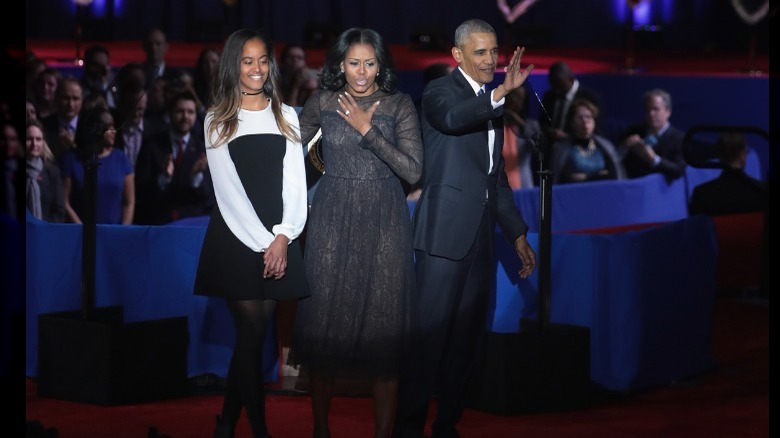 Malia Obama with her parents