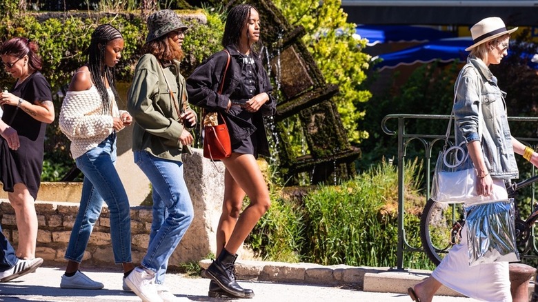 Malia and Sasha Obama walking with group