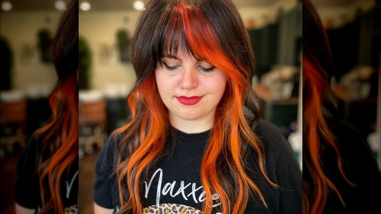 Woman with shaggy brown-and-orange hair