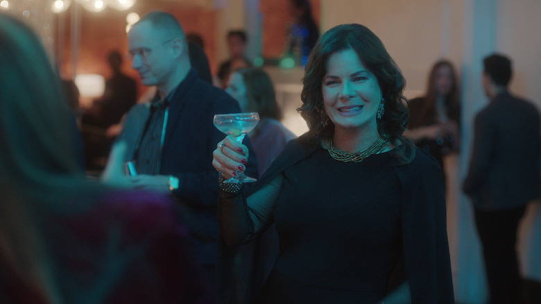 Marcia Gay Harden raising a glass in Uncoupled