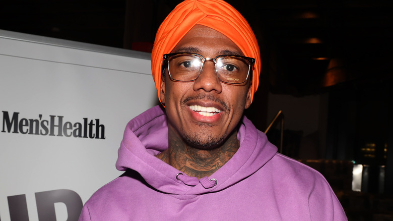 Nick Cannon smiles at event