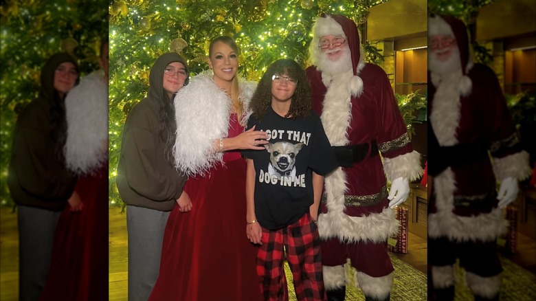 Monroe Cannon, Mariah Carey, and Moroccan Cannon posing with Santa