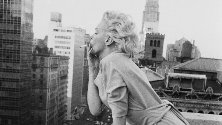 Marilyn Monroe looking over the streets of NYC, smoking