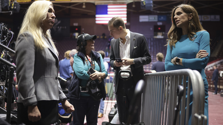 Speaker Mike Johnson and Nancy Mace glaring at each other