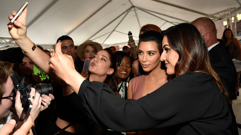 Kim Kardashian posing for selfies