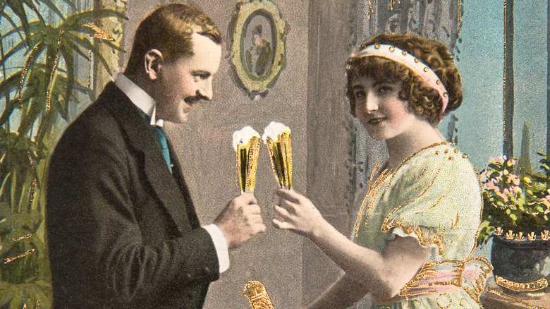 couple toasting champagne early 20th century