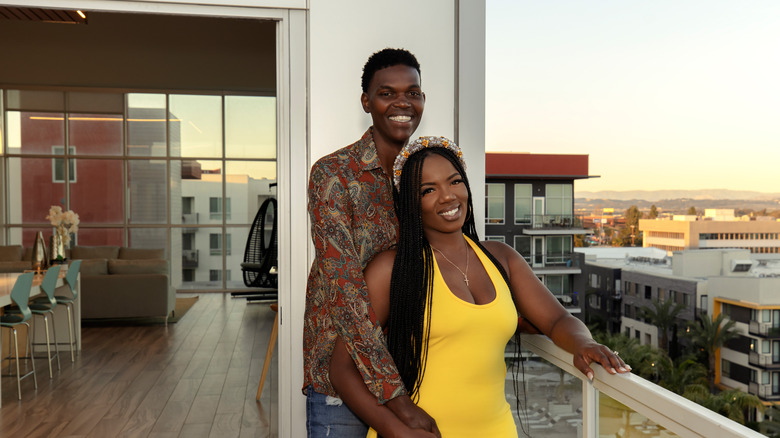 Alexis Mitchell and Justin Hall on balcony