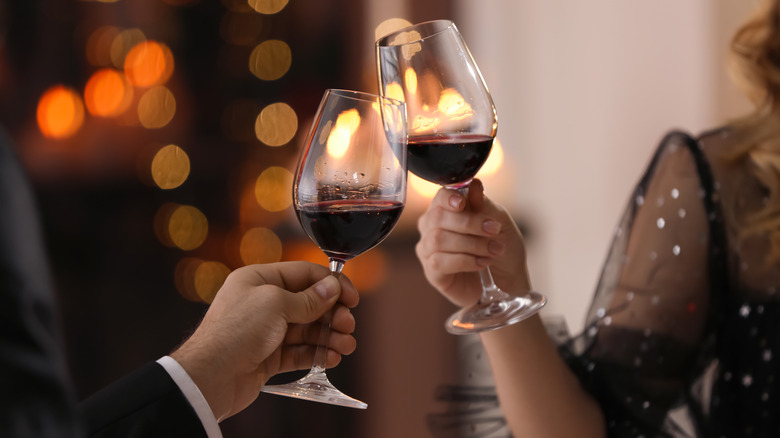 couple clinking wine glasses