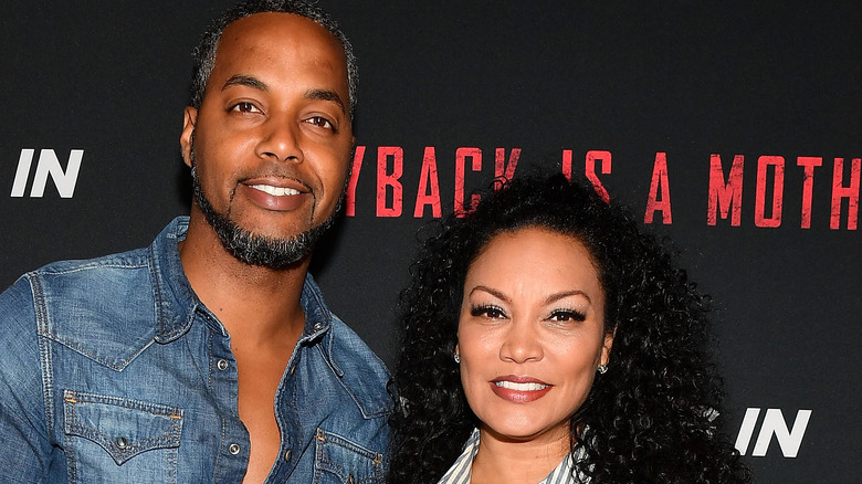 Egypt Sherrod and Mike Jackson pose together at an event