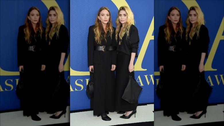 Mary Kate and Ashley Olsen wearing black on the red capet