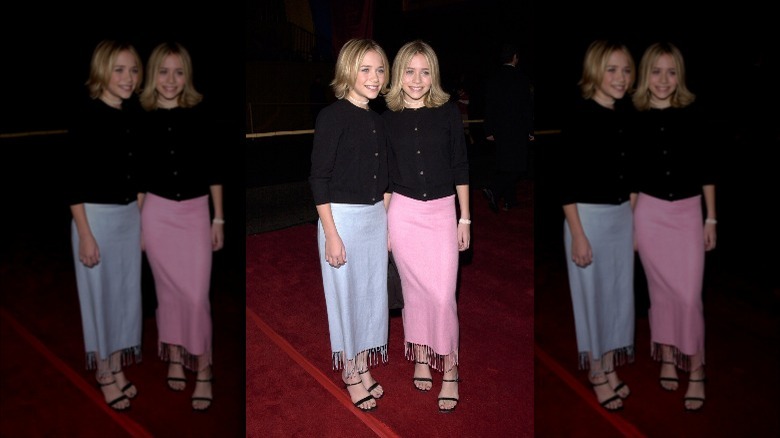 Mary Kate and Ashley Olsen wear pink and blue skirts on the red carpet