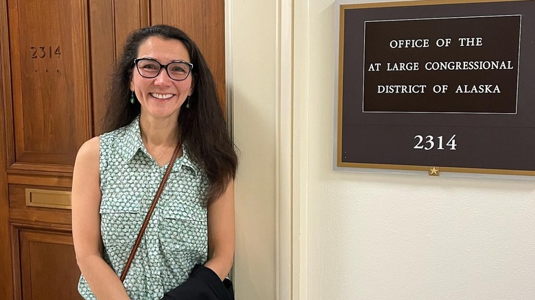 Mary Peltola standing next to her office door