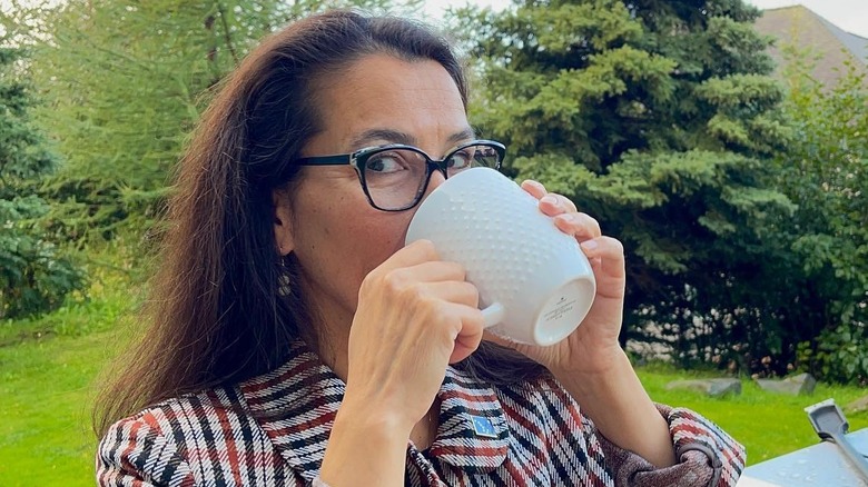 Mary Peltola drinking from a mug