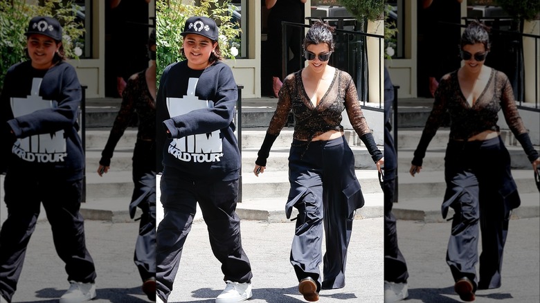 mason disick walks with kourtney kardashian