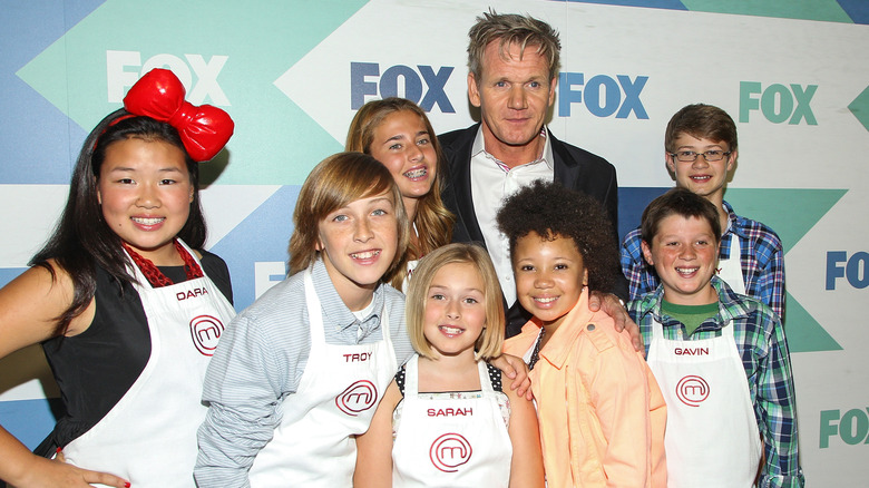 Gordon Ramsay posing with "Masterchef Junior" contestants