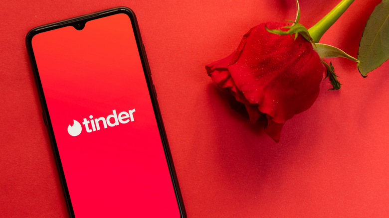 Phone with Tinder app open 