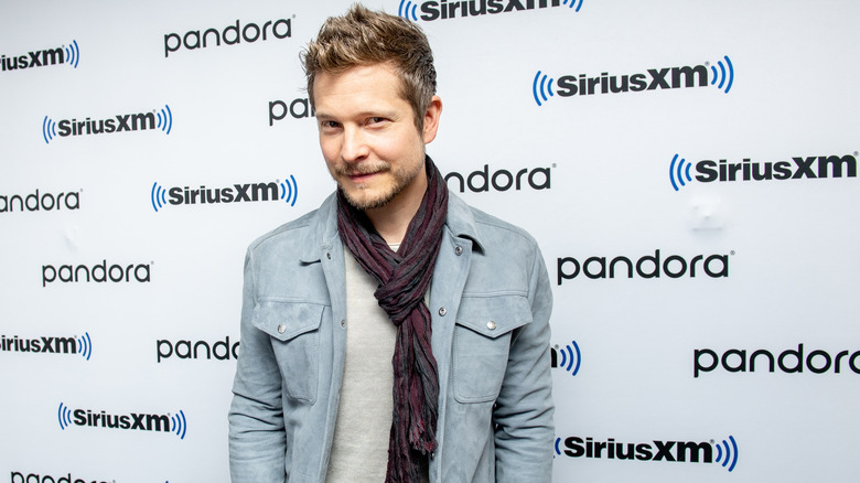 Matt Czuchry poses on the red carpet