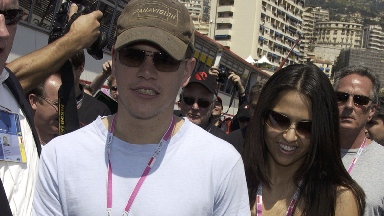 Young Matt Damon and Luciana Barroso walk through paparazzi 