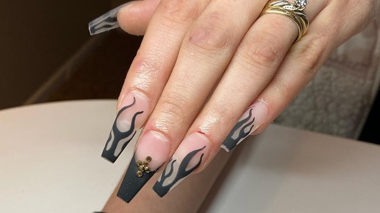 Modern French tip nails with black flames