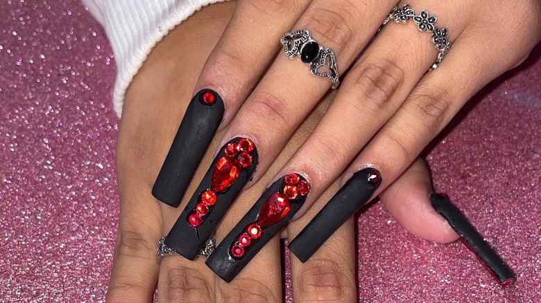 Black nails with red jewels