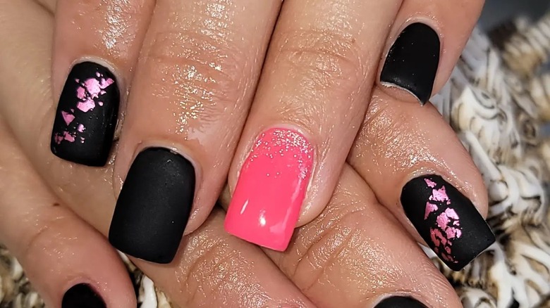 Black and pink nails with pink flakes