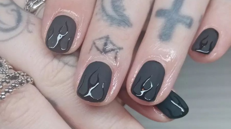 Flat black nails with shiny black flames