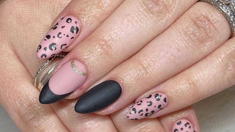 Flat black and pink cheetah nails